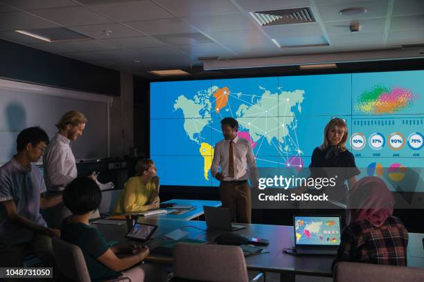 presentation in a university against an information wall - invention of photography is presented to the world stock pictures, royalty-free photos & images