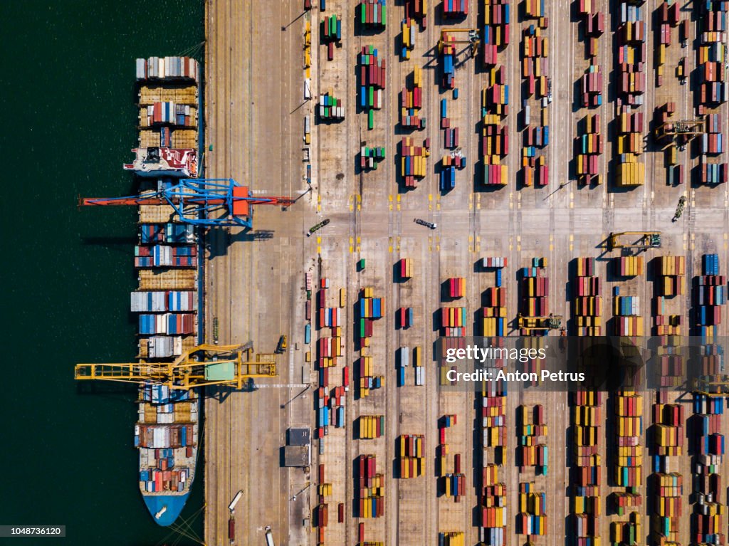 Aerial view of cargo ship, cargo container in warehouse harbor at Valencia
