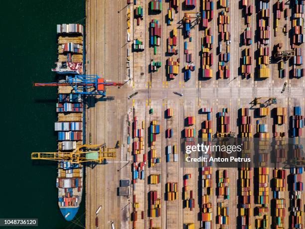 aerial view of cargo ship, cargo container in warehouse harbor at valencia - shipyard aerial stock pictures, royalty-free photos & images