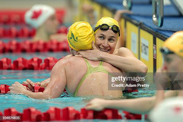 Sophie Edington of Australia congratulates gold medal winner Emily Seebohm of Australia after the Women's 100m Backstroke Final at the Dr. S.P....