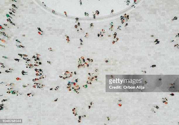 high angle view of people on street - large group of people stock pictures, royalty-free photos & images