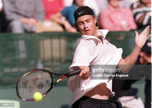 Lleyton Hewitt of Australia hits a forehand during his 6-4, 6-1 victory over Andre Sa of Brazil during the NEC Davis Cup semi final between Australia...