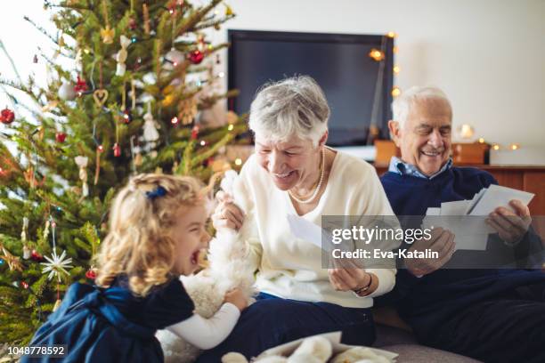 christmas portrait of a happy family - christmas photo album stock pictures, royalty-free photos & images