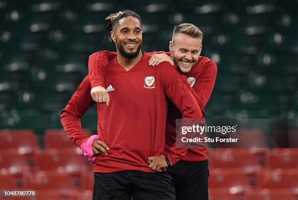 Ashley Williams and Chris Gunter share a joke during a Wales Training Session at Principality Stadium on October 10, 2018 in Cardiff, Wales.