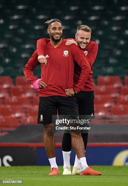 Ashley Williams and Chris Gunter share a joke during a Wales Training Session at Principality Stadium on October 10, 2018 in Cardiff, Wales.