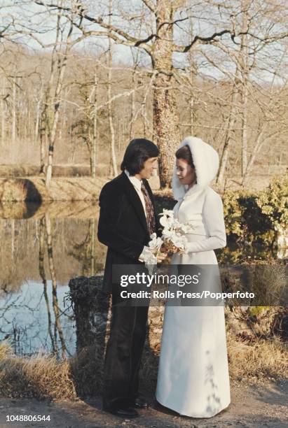 Romanian tennis player Ilie Nastase pictured with his wife, Belgian model Dominique Grazia on the day of their wedding at Bazoches-sur-le-Betz church...