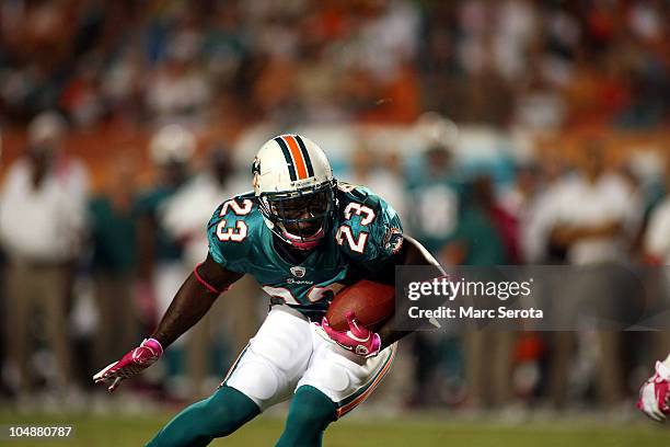 Running back Ronnie Brown of the Miami Dolphins runs against the New England Patriots at Sun Life Stadium on October 4, 2010 in Miami, Florida.