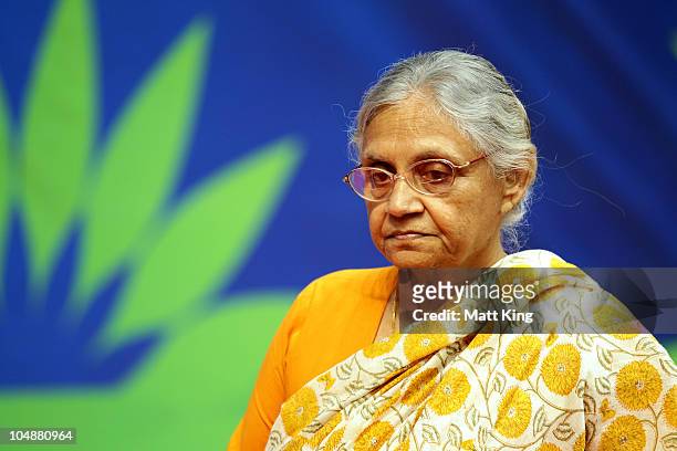 Chief Minister of Delhi, Sheila Dikshit attends the medal ceremony for the Women's 100m Freestyle Final at the Dr. S.P. Mukherjee Aquatics Complex...