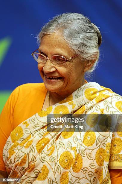 Chief Minister of Delhi, Sheila Dikshit attends the medal ceremony for the Women's 100m Freestyle Final at the Dr. S.P. Mukherjee Aquatics Complex...
