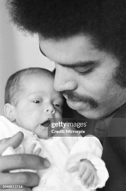 Baby Louise Brown in the safe arms of her father Colin Brown, at the home of her maternal grandparents, Ray and Myra Balch, in Rutland Street,...