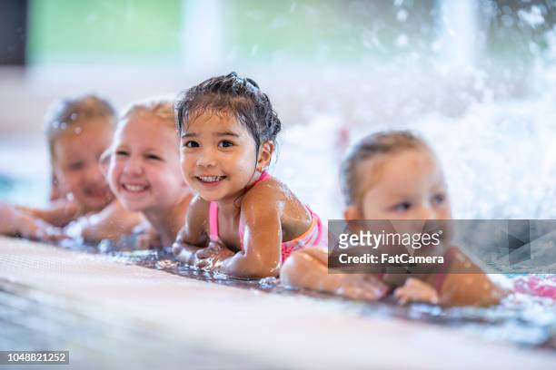 splashing kids - swimming stock pictures, royalty-free photos & images