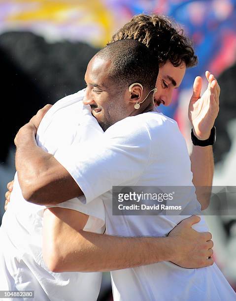 Kobe Bryant of the Los Angeles Lakers hugs his teammate Pau Gasol during the 'House of Hoops' contest by Foot Locker on October 6, 2010 in Barcelona,...