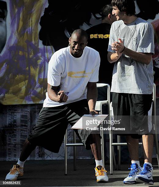 Kobe Bryant of the Los Angeles Lakers and Ricky Rubio of Regal FC Barcelona react during the 'House of Hoops' contest by Foot Locker on October 6,...