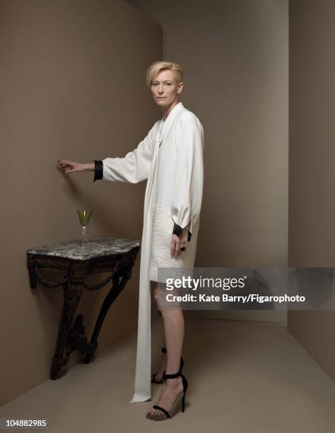 Actress Tilda Swinton poses at a portrait session for Madame Figaro Magazine in 2010. Dress by Celine, ring by Pomellato. Hair by Marion Anee. Makeup...
