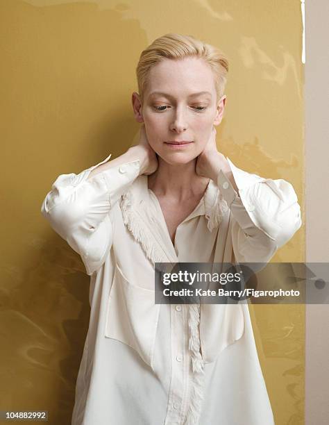 Actress Tilda Swinton poses at a portrait session for Madame Figaro Magazine in 2010. Silk shirt by Celine. Hair by Marion Anee. Makeup by Brigitte...