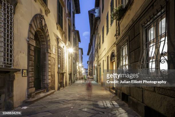 the old city of lucca at night in tuscany, italy. - lucca italy stock pictures, royalty-free photos & images
