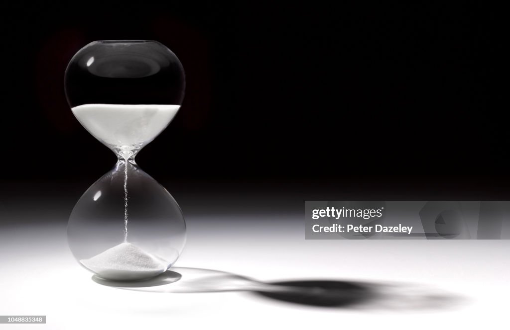 Hourglass time with sand running through