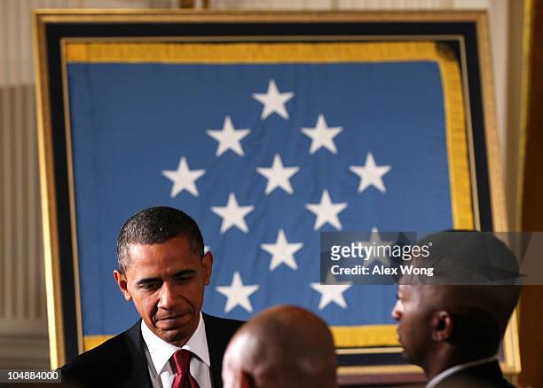 President Barack Obama leaves after an East Room presentation ceremony of a Medal of Honor October 6, 2010 at the White House in Washington, DC. Army...