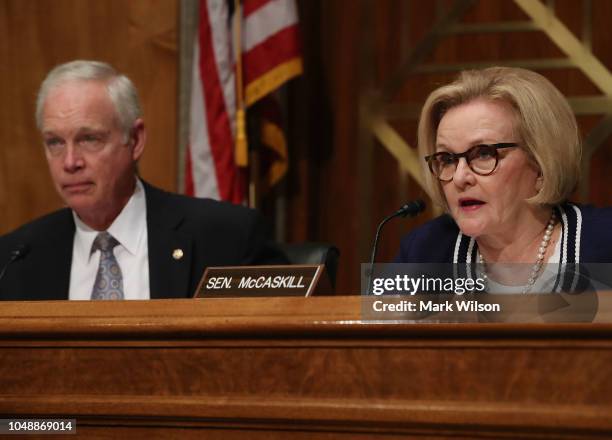 Sen. Claire McCaskill speaks while flanked by Chairman Ron Johnson during a Senate Homeland Security and Governmental Affairs Committee hearing on...