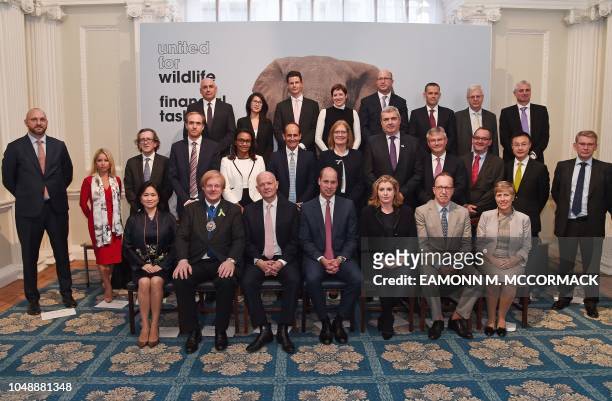 Britain's Prince William, Duke of Cambridge , poses for a family photograph with attendees after hosting the signing ceremony of United For...