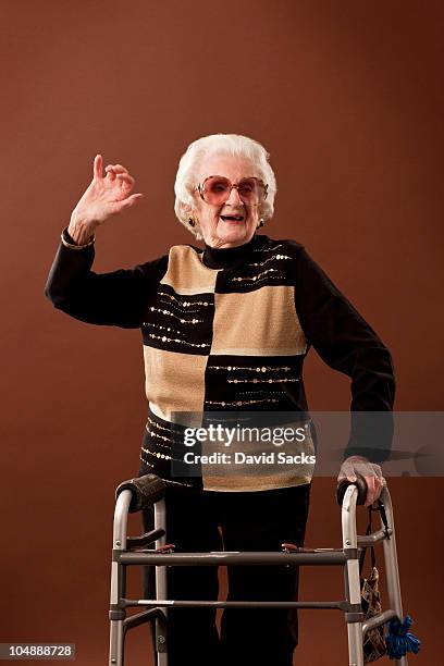 senior woman with walker dancing - walking frame stock pictures, royalty-free photos & images