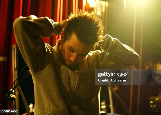 Jerry Horton of Papa Roach inserts his earplugs prior to his performance at the Warfield in San Francisco.