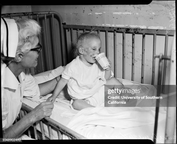 Baby beaten by ex-marine Girard J McNulty, 28 June 1957. Joyce Ellen Meyer - 2 years ;Irene Halfyard ;Lara Donnelly - 21 years .;Caption slip reads:...