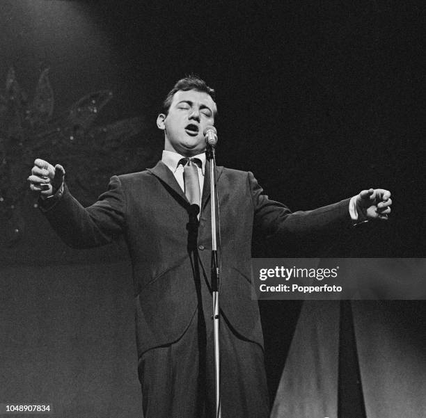 American singer and actor Bobby Darin performs live on stage in London in June 1960.
