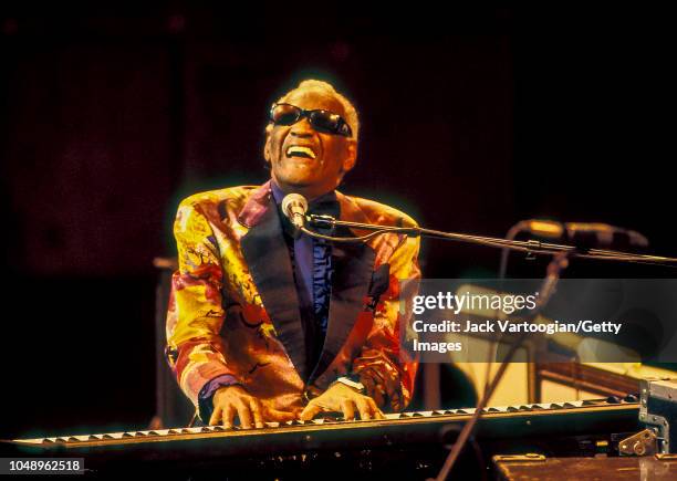 American R&B and Soul musician and band leader Ray Charles plays piano as he performs during a JVC Jazz Festival concert at Avery Fisher Hall at...