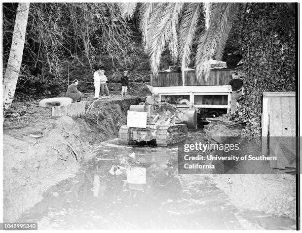 Flood damage repair at Benedict Canyon Drive damage at North Beverly Glen Boulevard, 19 January 1952. Home of Louis Wolf, 1551 North Beverly Glen...