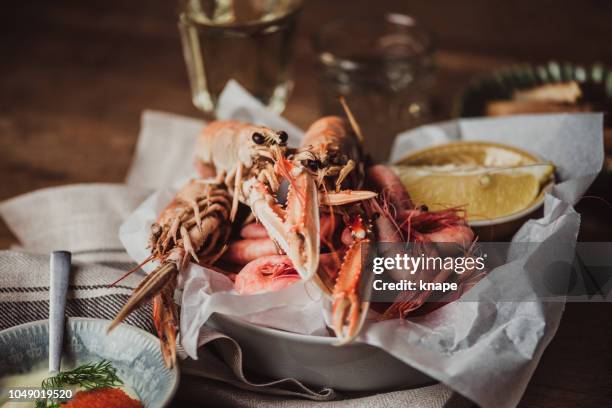 north sea shrimps and langoustine scampi served ready to eat - scampi stock pictures, royalty-free photos & images