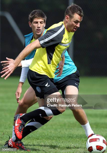 Shane Smeltz gets past Andy Boyens during the a New Zealand All Whites training session at Kristin School on October 7, 2010 in Auckland, New Zealand.