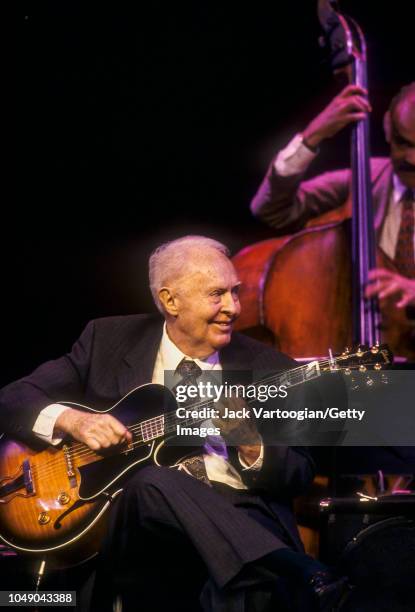 American Jazz musician Herb Ellis plays guitar as he performs at the JVC Jazz Festival 'To Herb Ellis With Love' concert at Kaye Playhouse at Hunter...