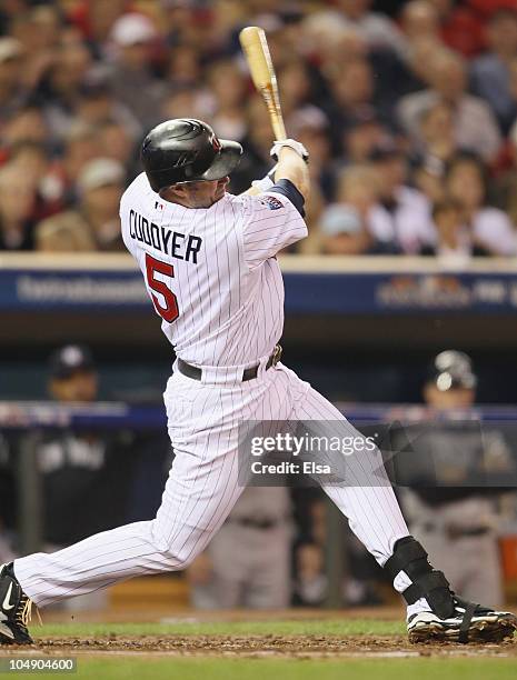 Michael Cuddyer of the Minnesota Twins hits a two run homer in the second inning against the New York Yankees during game one of the ALDS on October...