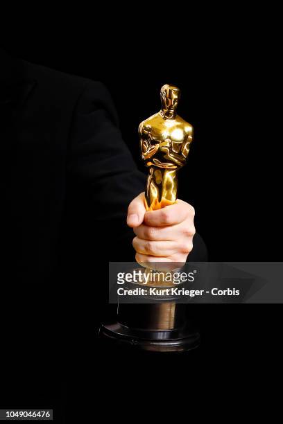 Academy Award winner´s hand holding an Oscar statue in the press room during the 90th Annual Academy Awards at Hollywood & Highland Center on March...