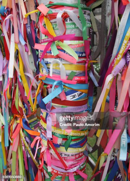 colourful pilgrims ribbons tied at basilic nazareth in belém,brazil - nazareth band stock-fotos und bilder