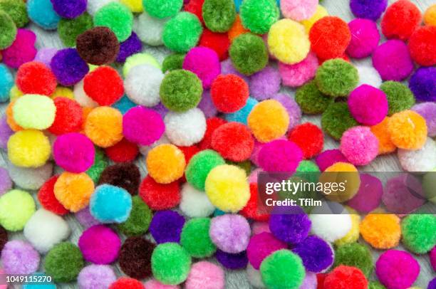 a colorful pom pom background - pom pom stock pictures, royalty-free photos & images