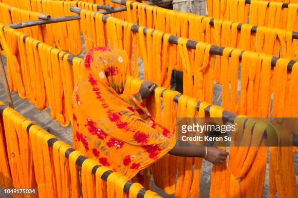 drying dyed yarn in the traditional weaving village, tangail district, dhaka division, bangladesh - bangladesh culture stock pictures, royalty-free photos & images