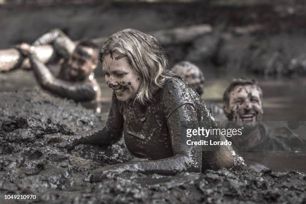 mud run spouses - obstacle course stock pictures, royalty-free photos & images