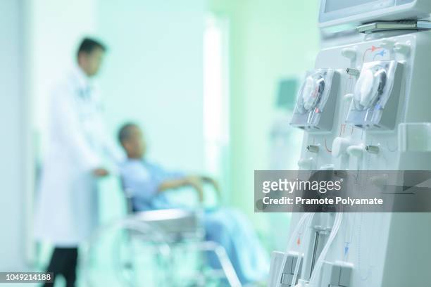 hemodialysis machines with tubing and installations. asian patient in wheelchair sitting in hospital corridor with asian male doctor, medical equipment concept. - chronic condition stock pictures, royalty-free photos & images