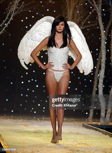 Caroline Ribeiro wearing white embellished Victoria's Secret corset and embellished Victoria's Secret body bare satin thong