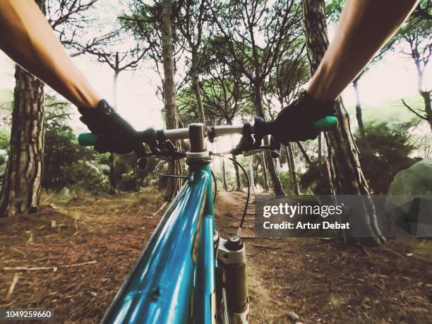 riding mountain bike in the mountain nature from personal perspective. - fahrradlenker stock-fotos und bilder