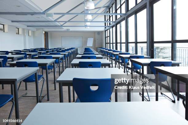 big empty classroom at modern school - empty desk chair stock pictures, royalty-free photos & images