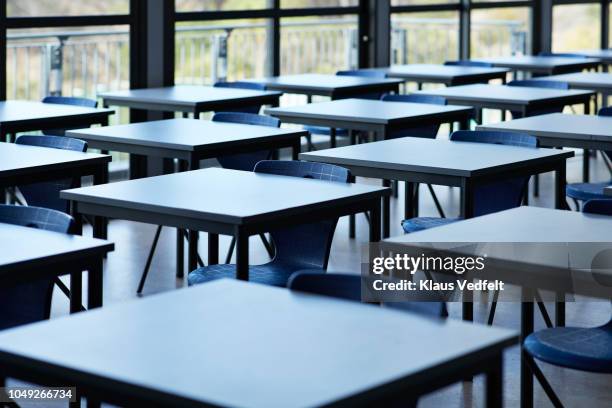 big empty classroom at modern school - sparse desk stock pictures, royalty-free photos & images