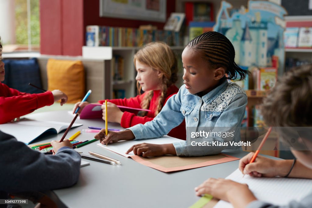 School children drawing at the school library
