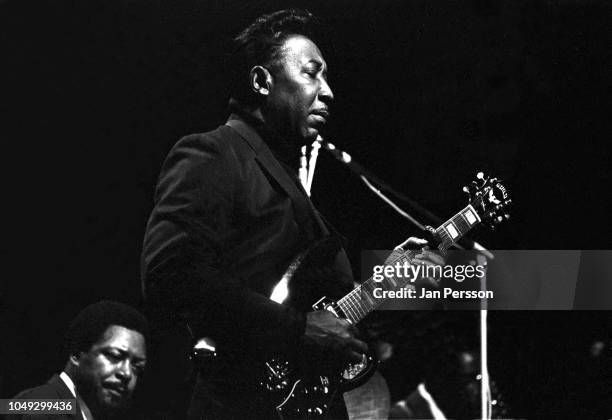 American blues singer and guitarist Muddy Waters with in the back American blues pianist Otis Spann, Copenhagen, Denmark, 1968.