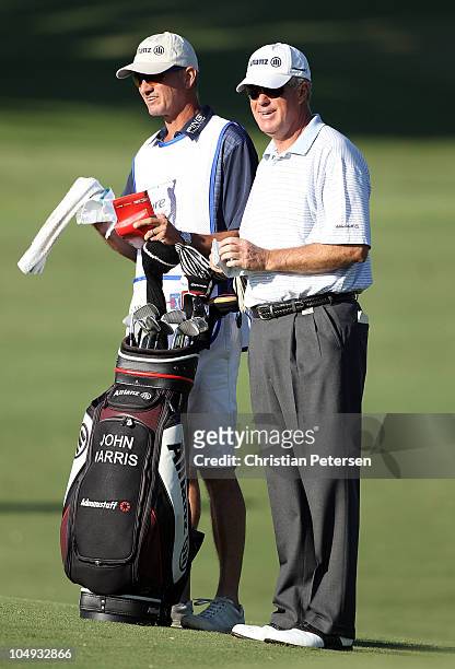 John Harris stands with his caddy and bag on the first hole during the first round of the Ensure Classic at the Rock Barn Golf & Spa on October 1,...