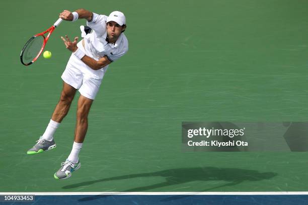 Jeremy Chardy of France serves in his match against Andy Roddick of the United States on day four of the Rakuten Open tennis tournament at Ariake...