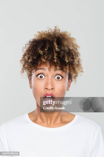 portrait of shocked afro american woman - bad news stock pictures, royalty-free photos & images