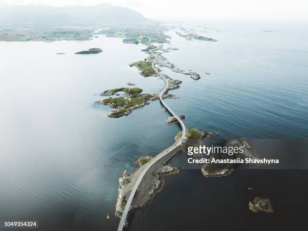 aerial view of stunning bridge road and small islands in the sea in norway - road stock pictures, royalty-free photos & images